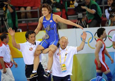 Kaori Icho of Japan celebrates after beating Alena Kartashova of Russia during the women's freestyle 63 kg gold medal match of Beijing 2008 Olympic Games Wrestling event in Beijing, China, Aug. 17, 2008. Kaori Icho beat Alena Kartashova and grabbed the gold.(Xinhua Photo)