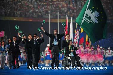 Members of the Paralympic Delegation of China's Macao parade into the National Stadium during the opening ceremony of the Beijing 2008 Paralympic Games in Beijing, China, Sept. 6, 2008. (Xinhua photo)