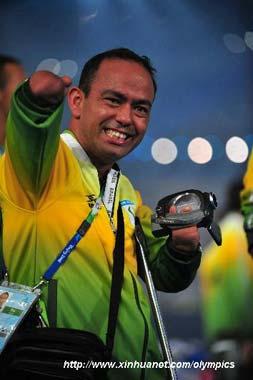 A member of the Paralympic Delegation of Brazil parades into the National Stadium during the opening ceremony of the Beijing 2008 Paralympic Games in Beijing, China, Sept. 6, 2008. (Xinhua photo)