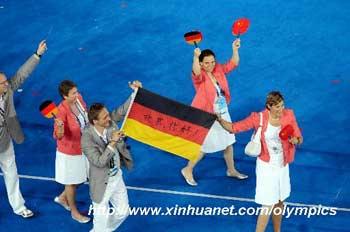 Members of the Paralympic Delegation of Germany hold a German national flag with "Hello, Beijing" written in Chinese as they parade into the National Stadium during the opening ceremony of the Beijing 2008 Paralympic Games in Beijing, China, Sept. 6, 2008. (Xinhua/Guo Dayue)