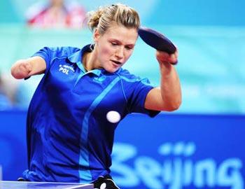 Natalia Partyka of Poland returns the ball during a semifinal of women's individual (Class F10) against Michala la Bourdonnaye of Czech at the Beijing 2008 Paralympic Games table tennis event on Sept. 10, 2008. Partyka won 3-0 and advanced to the final. The 19-year-old Polish player, who was born with a right arm that ends at the elbow, is the Paralympic champion in Athen 2004. Before defending her Paralympic title, she played in the table tennis team event at Beijing 2008 Olympic Games, which made her one of only two athletes, along with South African swimmer Natalie du Toit, to compete in both Olympic and Paralympic in Beijing.(Xinhua Photo)