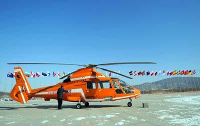 A helicopter is ready to takes off from the parking apron of Yabuli Ski Resort, 195km southeast away from Harbin City, capital of northeast China's Heilongjiang Province, Feb 17, 2009. The 24th World Winter Universiade will start on Feb. 18 in Harbin. Sports including Alpine Skiing, Cross-Country Skiing, Ski Jumping, Nordic Combined, and Freestyle Skiing will be competed at the Yabuli Ski Resort from Feb. 20. (Xinhua/Xu Yu)