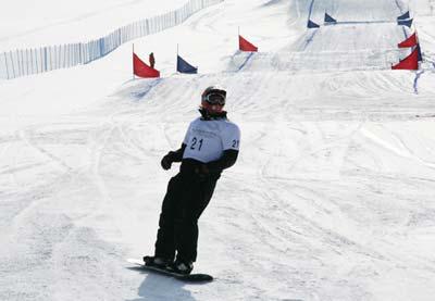 Snowboarders warm up for the qualifying heats at the 24th Winter Universiade at Maoershan Ski Resort on Friday morning. 