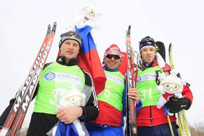 Gold medalist Artem Gusev (C) of Russia, Silver medalist Oleg Berezhnoy (L) of Ukraine and bronze medalist Jaroslav Soukup of Czech pose for group photos after the men's 10km sprint of biathlon at the Maoershan Ski Resort in Maoershan Town 85km southeast from Harbin, capital of northeast China's Heilongjiang Province, Feb. 24, 2009. ((Xinhua Photo)