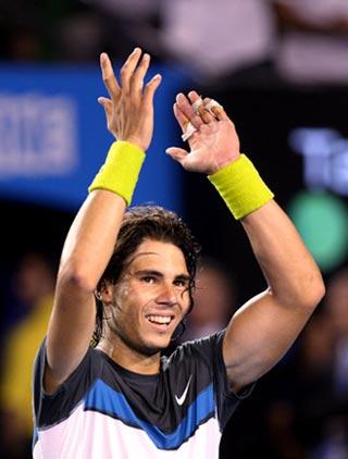 Rafael Nadal of Spain gestures to the crowd after the men's singles final against Roger Federer of Switzerland at Australian Open tennis tournament in Melbourne, Feb. 1, 2009. Nadal won the match 3-2. (Xinhua/Han Yan)