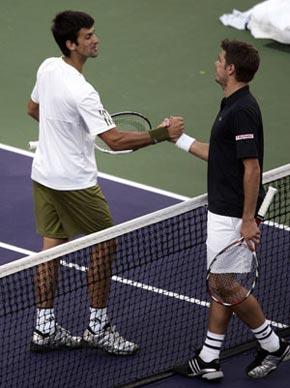 Novak Djokovic of Serbia (L) and Switzerland's Stanislas Wawrinka shake hands at the conclusion of their match at the Indian Wells ATP tennis tournament in Indian Wells, California, March 18, 2009. (Xinhua/Reuters Photo)