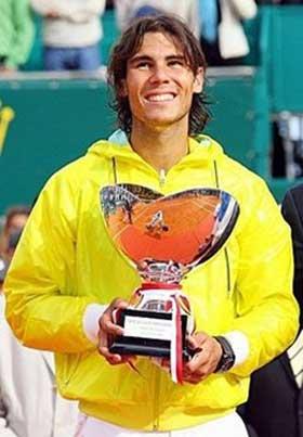 Spanish world number one Rafael Nadal poses with his trophy after the Monte-Carlo ATP Masters Series final, in Monaco. Nadal won his fifth successive Monte Carlo title by beating Serbia's Novak Djokovic 6-3, 2-6, 6-1.(AFP/Stephane Danna) 