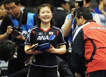 Japan's Fukuhara Ai (C) smiles after the women's doubles third round match against Germany's Elke Schall and Wujiaduo at the World Table Tennis Championships 2009 in Yokohama, Japan, on May 2, 2009. Fukuhara Ai and her partner Hirano Sayaka won 4-2 and qualified for the quarterfinals. (Xinhua/Xu Jiajun)