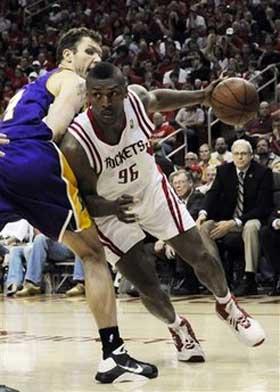 Houston Rockets' Ron Artest (96) drives the the basket as Los Angeles Lakers' Luke Walton (4) defends during the second half of Game 4 of their second round Western Conference NBA playoff basketball series Sunday, May 10, 2009 in Houston. The Rockets won 99-87.(AP Photo/Pat Sullivan) 