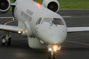 A Brazilian Air Force plane takes part in search operations of the missing Air France jet, at an airport of Fernando de Noronha, northeast of Brazil, Tuesday, June 2, 2009.(AP Photo/Eraldo Peres)