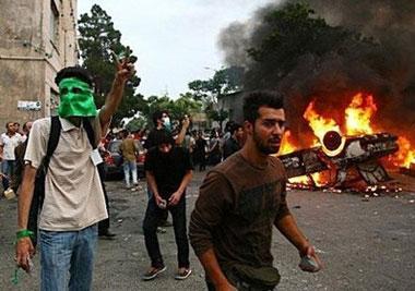 Protesters set a car on fire in Tehran on June 15. Iran's election watchdog said on Tuesday it was ready for a recount in the hotly disputed presidential vote. (AFP)