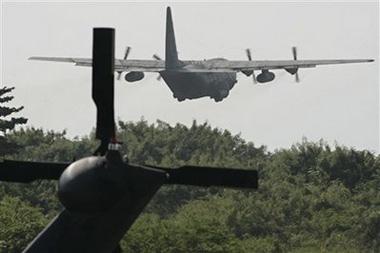  A Brazilian Air Force plane takes off for search operations of the missing Air France flight 447 in Fernando de Noronha island, off the northeast coast of Brazil, Friday, June 12, 2009. (AP Photo/Eraldo Peres)