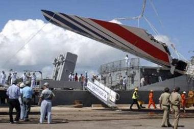 Debris of the missing Air France flight 447, recovered from the Atlantic Ocean, arrives at Recife's port June 14, 2009.REUTERS/JC Imagem/Alexandre Severo