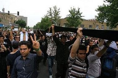 In this image made available from Mousavi's election campaign media operation Ghalam News shows supporters of Iranian opposition leader Mir Hossein Mousavi, carrying a black banner during a demonstration in Tehran on Thursday June, 18, 2009.(AP Photo/Ghalam News.)