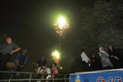 Fireworks light up the night sky above Baghdad, Iraq, Monday, June 29, 2009. U.S. troops will be out of Iraqi cities by tomorrow Tuesday June 30 in the first step toward winding down the American war effort by the end of 2011.(AP Photo/ Khalid Mohammed)