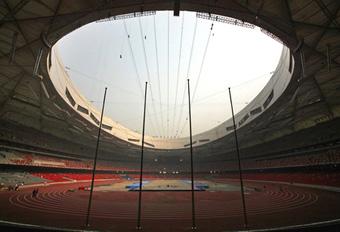 Flag poles can be seen next to the track at the National Stadium, also known as the Bird's Nest, in Beijing April 16, 2008. The stadium will host the Good Luck Beijing Race Walking Challenge on Thursday, the first event to be held at the 2008 Beijing Olympic Games athletics stadium. [Agencies]