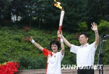 The Olympic torch is carrying through Leshan, Sichuan province.