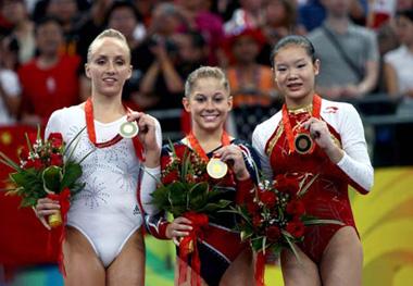 Gold medalist Shawn Johnson (C) of the United States, silver medalist Nastia Liukin (L) of the United States, and China's bronze winner Cheng Fei celebrate during the awarding ceremony for women's balance beam final of Beijing 2008 Olympic Games at National Indoor Stadium in Beijing, China, Aug. 19, 2008. (Xinhua Photo)