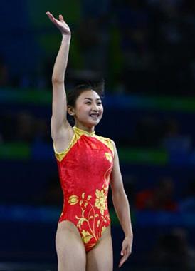 China's He Wenna gestures after her performance during trampoline women's final of Beijing 2008 Olympic Games at National Indoor Stadium in Beijing, China, Aug. 18, 2008. He claimed the title of the event with a score of 37.80. (Xinhua Photo)