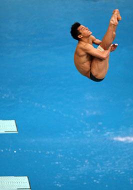 He Chong of China performs a dive during the Men's 3m Springboard Final of Beijing 2008 Olympic Games diving event in Beijing, China, Aug. 19, 2008. He Chong claimed gold of the event with a total score of 572.90 points. (Xinhua/Liu Yu)