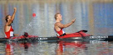 Martin Hollstein (R) and Andreas Ihle of Germany celebrate after winning the Kayak double (K2) 1000m men final of Beijing 2008 Olympic Games Canoe/Kayak Flatwater event in Beijing, China, Aug. 22, 2008. The German pair clinched the gold medal in this event with a time of 3:11.809. (Xinhua/Jiang Enyu) 