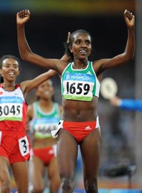Tirunesh Dibaba of Ethiopia celebrates after the women's 5,000m final at the National Stadium, also known as the Bird's Nest, during Beijing 2008 Olympic Games in Beijing, China, Aug. 22, 2008. Tirunesh Dibab won the gold.(Xinhua/Guo Dayue)