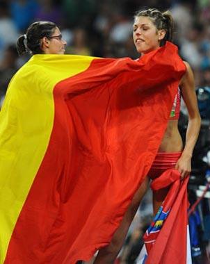 Tia Hellebaut (L) of Belgium celebrates with Blanka Vlasic of Croatia after the women's high jump final at the National Stadium, also known as the Bird's Nest, during Beijing 2008 Olympic Games in Beijing, China, Aug. 23, 2008. Tia Hellebaut won the title with 2.05 metres. Blanka Vlasic took the silver.(Xinhua Photo)
