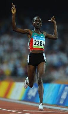 Nancy Jebet Langat of Kenya gestures as she crosses the finish line during the women's 1,500m final at the National Stadium, also known as the Bird's Nest, during Beijing 2008 Olympic Games in Beijing, China, Aug. 23, 2008. Nancy jebet Langat won the title with 4:00.23. (Xinhua/Guo Dayue)