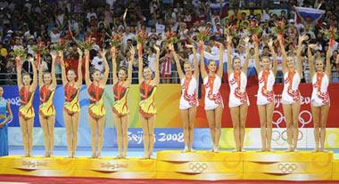 Gold medalists of Russia (R) and silver medalists of China stand on the podium at the awarding ceremony of the group all-around final of Beijing Olympic Games gymnastics rhythmic event in Beijing, China, Aug. 24, 2008.(Xinhua Photo)