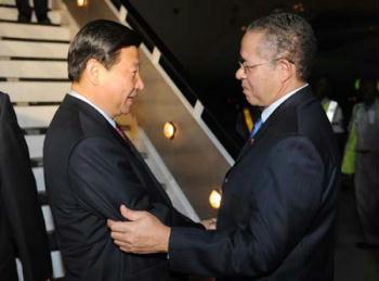 Chinese Vice President Xi Jinping (L) is greeted by Jamaican Prime Minister Bruce Golding upon his arrival in Kingston, capital of Jamaica, on Feb. 11, 2009. Jamaica is the second leg of Xi's six-nation tour, which has taken him to Mexico and will take him to Colombia, Venezuela, Brazil and Malta. (Xinhua/Huang Jingwen)