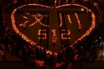 Students gather around candles displaying "Wenchuan" and "512" during an activity to mourn for the victims of the May 12, 2008 Wenchuan earthquake, at the Harbin Institute of Technology in Harbin, capital of northeast China's Heilongjiang Province, May 12, 2009, the anniversary of the fatal Wenchuan earthquake. (Xinhua Photo)