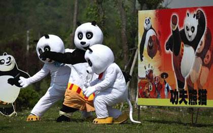 Cartoon panda stars are seen in a scenic spot of Nantong Horticulture Expo Park in Nantong, a city of east China's Jiangsu Province, April 27, 2009. Bringing many prevailing cartoon stars like panda Paul, Gray Wolf and Happy Sheep to meet visitors, 2009 Nantong Cartoon and Animation Festival was opened in Nantong Horticulture Expo Park on Monday. Activities focusing on eight themes would be held in different scenic spots of the park. (Xinhua/Ding Xiaochun)