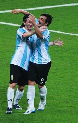 Lionel Messi (L) of Argentina and teammate celebrate after scoring a goal. (Photo credit: Pei Xin/Xinhua)