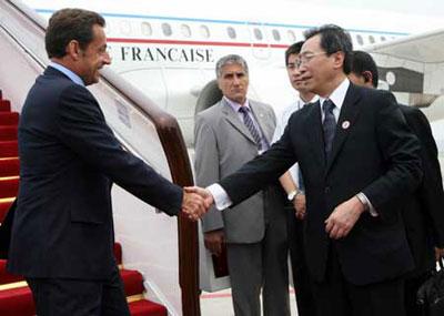 French President Nicolas Sarkozy (1st L) is greeted by Chinese Vice Minister of Foreign Affairs Wu Dawei (R, front) at the Beijing Capital International Airport in Beijing, China, Aug. 8, 2008. Nicolas Sarkozy arrived in Beijing on Thursday to attend the opening ceremony of the Beijing Olympic Games and other events. (Xinhua Photo)