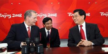 Chinese President Hu Jintao (R) and International Olympic Committee President Jacques Rogge (L) attend the opening ceremony of Beijing Olympic Games in Beijing, China, Aug. 8, 2008. (Xinhua Photo)