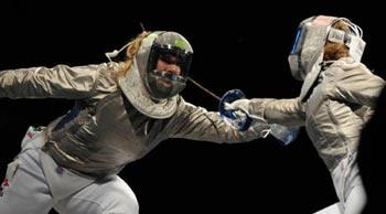 Zagunis(L) of the United States competes against her teammate Becca Ward during the women's individual sabre semifinal 2 at the Beijing 2008 Olympic Games, in Beijing, China, Aug. 9, 2008. Zagunis beat Ward in the bout. (Xinhua/Yang Lei)