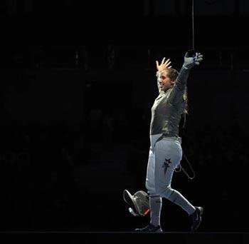 Mariel Zagunis of the United States celebrates after defeating her compatriot Sada Jacobson during the women's individual sabre gold medal match at the Beijing 2008 Olympic Games, in Beijing, China, Aug. 9, 2008. Zagunis won the gold medal. (Xinhua/Chen Xiaowei)