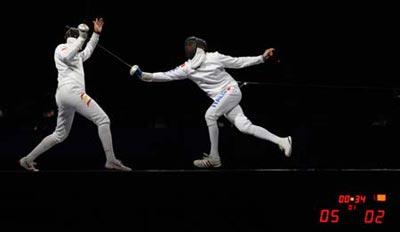 Jose Luis Abajo (L) of Spain competes against Matteo Tagliariol of Italy during men's individual epee semifinal of Beijing 2008 Olympic Games fencing event at Fencing Hall of National Convention Center in Beijing, China, Aug. 10, 2008. Matteo Tagliariol of Italy won 15-12 and qualified the final. (Xinhua Photo)