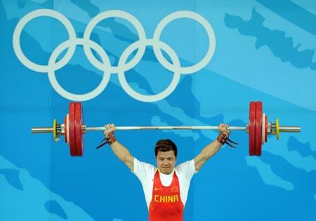 Zhang Xiangxiang of China takes a lift during men's weightlifting 62kg Group A competition of Beijing 2008 Olympic Games at Beijing University of Aeronautics & Astronautics Gymnasium in Beijing, China, Aug. 11, 2008. Zhang won the gold medal in the event. (Xinhua/Yang Lei) 
