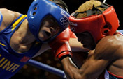 Chinese boxers into last 16, Russian world champion out 