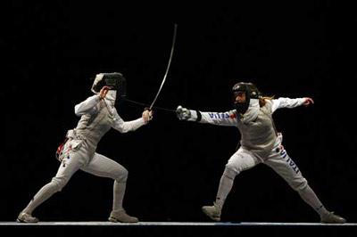Maria Valentina Vezzali (R) and Nam Hyun-hee compete. (Photo credit: Ezra Shaw/Getty Images)