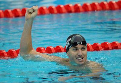 Aaron Peirsol of the United States celebrates after winning the men's 100m backstroke final at the Beijing 2008 Olympic Games in the National Aquatics Center, also known as the Water Cube in Beijing, China, Aug. 12, 2008. Peirsol set a new world record and won the gold medal in the event with 52.54 seconds.