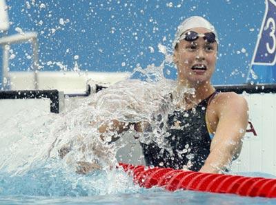 Federica Pellegrini of Italy celebrates during the final of women's 200m freestyle at the Beijing 2008 Olympic Games in the National Aquatics Center, also known as the Water Cube in Beijing, China, Aug. 13, 2008. 
