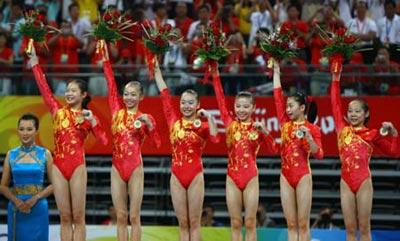 China's Cheng Fei, Yang Yilin, Li Shanshan, He Kexin, Jiang Yuyuan and Deng Linlin(L to R) celebrate their victory during the awarding ceremony for gymnastics artistic women's team final of Beijing 2008 Olympic Games at National Indoor Stadium in Beijing, China, Aug. 13, 2008. The Chinese team claimed the title of the event with a score of 188.900. (Xinhua/Ren Long)