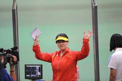 Chen Ying of China gestures during the women's 25m pistol final of the Beijing 2008 Olympic Games shooting event at the Beijing Shooting Range Hall in Beijing, China, Aug. 13, 2008. Chen Ying won the gold medal of the event.(Xinhua Photo/Bao Feifei)