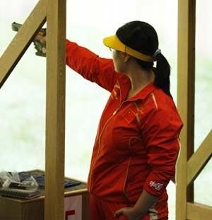 Chen Ying of China competes in the precision stage of the women's 25m pistol qualification of the Beijing 2008 Olympic Games shooting event at the Beijing Shooting Range Hall in Beijing, China, Aug. 13, 2008.(Xinhua Photo/Bao Feifei)