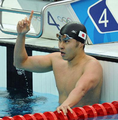 Kosuke Kitajima of Japan celebrates after winning the men's 200m breaststroke final at the Beijing 2008 Olympic Games in the National Aquatics Center, also known as the Water Cube in Beijing, China, Aug. 14, 2008. Kitajima set a new Olympic record and won the gold medal in the event with 2 minutes 7.64 seconds. (Xinhua/Chen Kai)