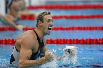 Alain Bernard of France celebrates after winning the men's 100m freestyle final at the Beijing 2008 Olympic Games in the National Aquatics Center, also known as the Water Cube in Beijing, China, Aug. 14, 2008. Bernard won the gold medal in the event with 47.21 seconds. (Xinhua/Ding Xu)