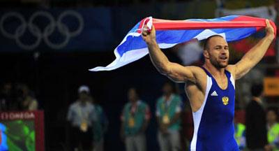 Aslanbek Khushtov of Russia celebrates after beating Mirko Englich of Germany during the men’s Greco-Roman 96kg final at the Beijing 2008 Olympic Games wrestling event in Beijing, China, Aug. 14, 2008. Aslanbek Khushtov won the bout and grabbed the gold medal. (Xinhua Photo)