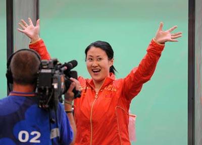 Chen Ying of China celebrates during the women's 25m pistol final of the Beijing 2008 Olympic Games shooting event at the Beijing Shooting Range Hall in Beijing, China, Aug. 13, 2008. Chen Ying shot 793.4 points to win the gold medal of the event.(Xinhua Photo)